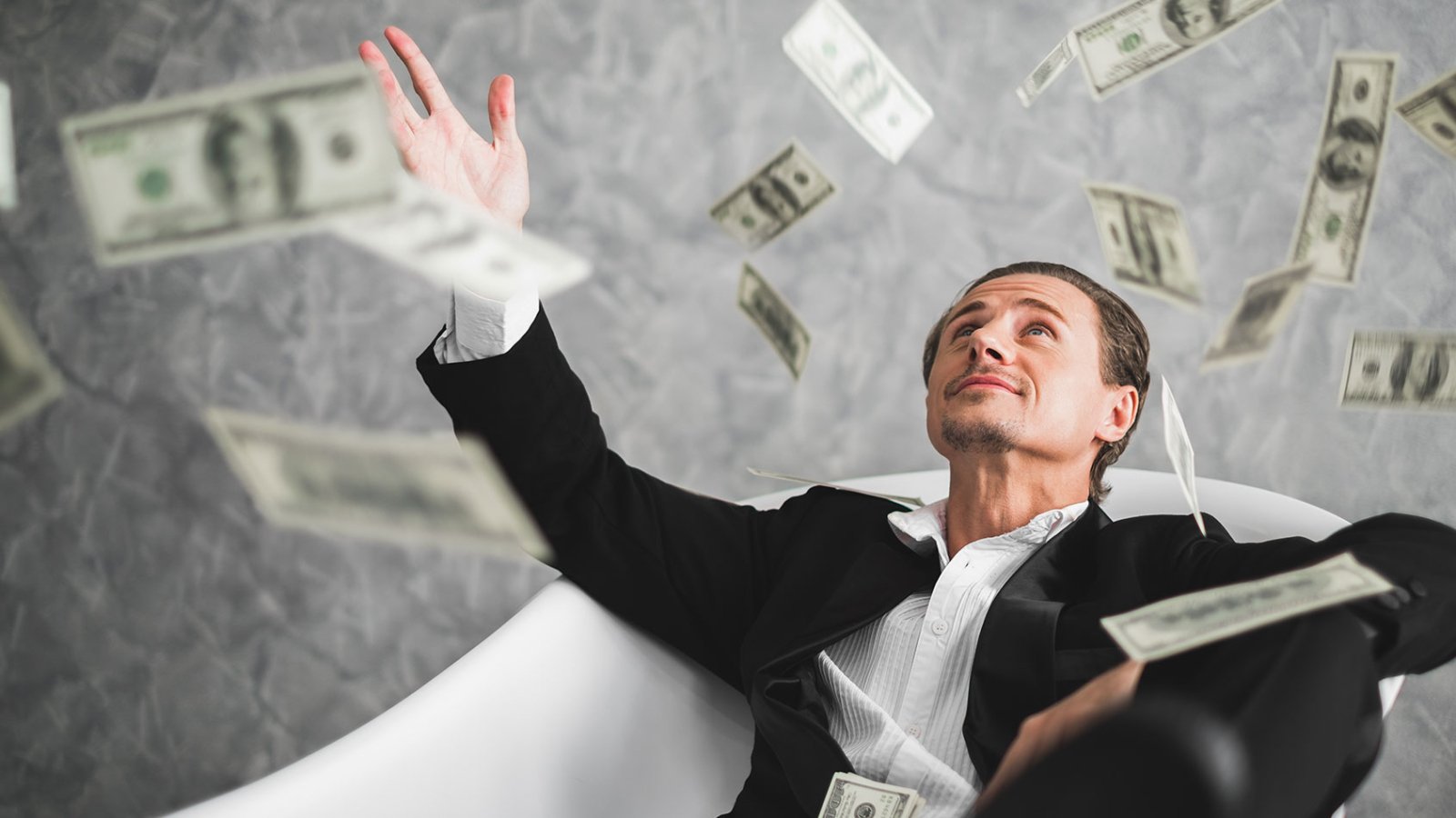 rich-man-money-bathtub-0402211